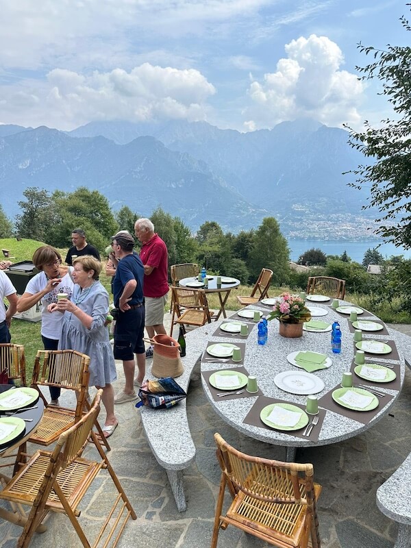 Outdoor dining with a view of Lake Como at Baita TreeB in Bellagio.